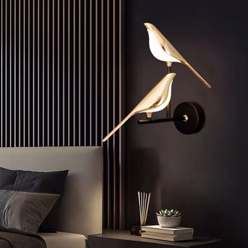 Modern bird-shaped wall lamp with magnetic attachment, featuring sleek LED lighting and elegant design for stylish interiors.