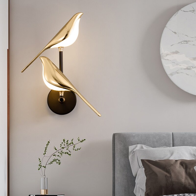 Modern bird-shaped wall lamp with magnetic attachment, featuring sleek LED lighting and elegant design for stylish interiors.