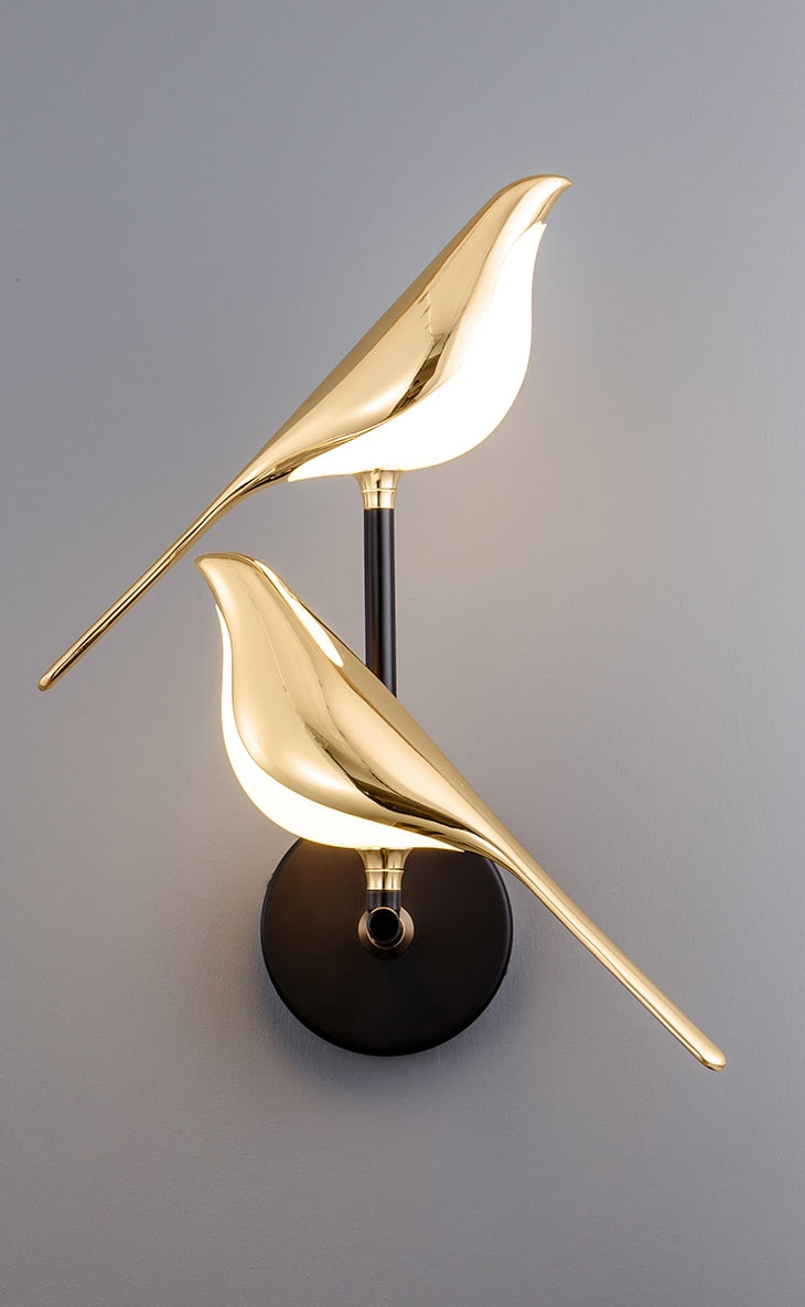 Modern bird-shaped wall lamp with magnetic attachment, featuring sleek LED lighting and elegant design for stylish interiors.