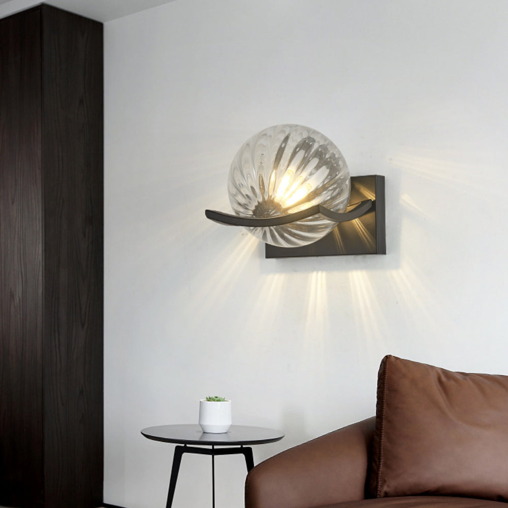 Modern LED wall lamp with sleek glass finish, ideal for contemporary home decor and energy-efficient lighting.