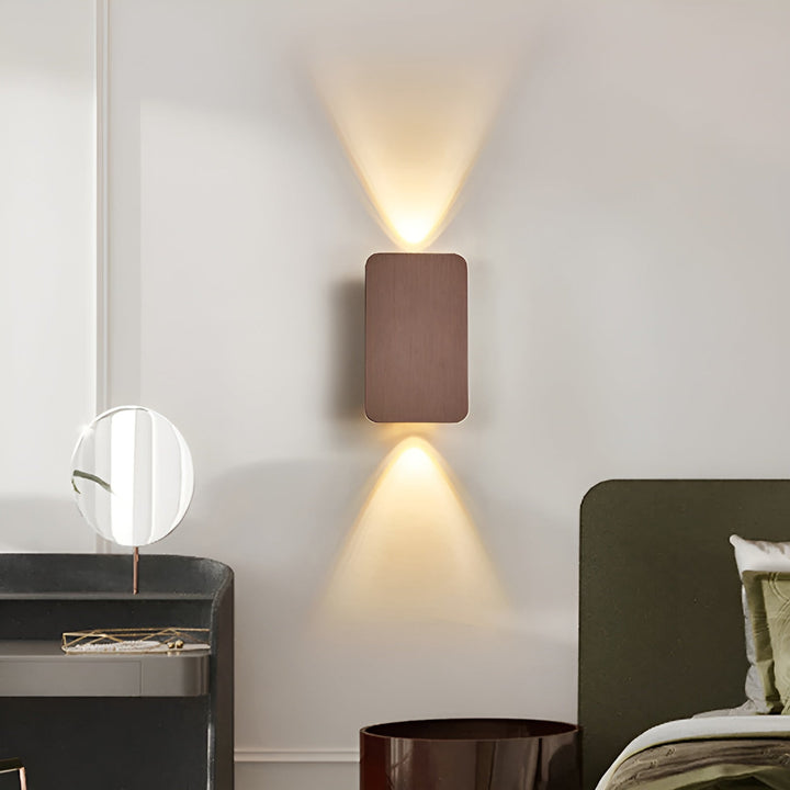 Contemporary LED up/down wall sconce, sleek design for modern indoor lighting & decor.