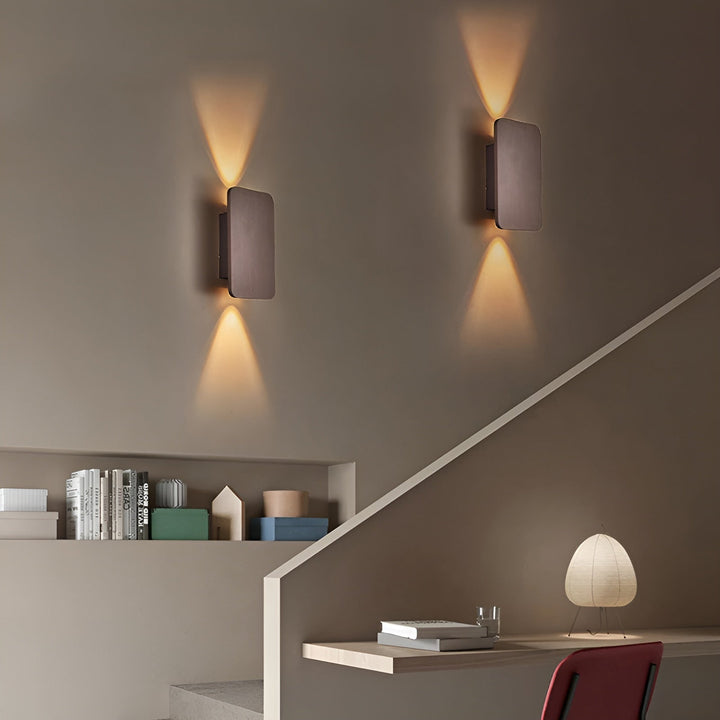 Energy-efficient LED wall lamp creating a beautiful up/down light beam, enhancing room ambiance.