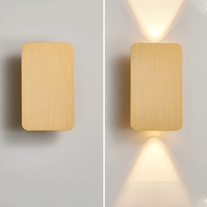 Elegant LED wall sconce, featuring modern up/down lighting to create a sophisticated interior atmosphere.