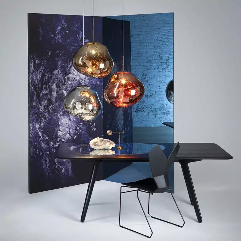 Unique Melt design pendant lamp, atmospheric light object with a polished metallic finish.