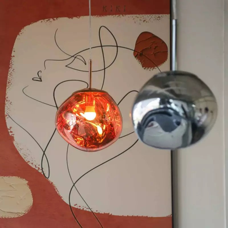 Modern sculptural Melt pendant light, elegant and atmospheric for sophisticated living spaces.