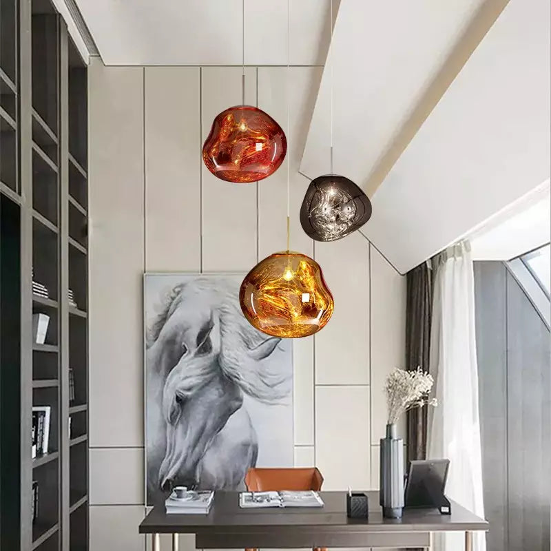 Artistic Melt ceiling lamp, atmospheric golden hue, perfect for dining room lighting.