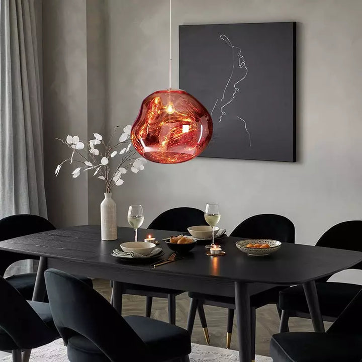 Stylish Melt pendant light, contemporary silver metallic design, enhances modern homes.