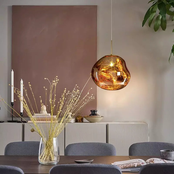 Contemporary Melt pendant light, unique organic shape, enhances living room ambiance.