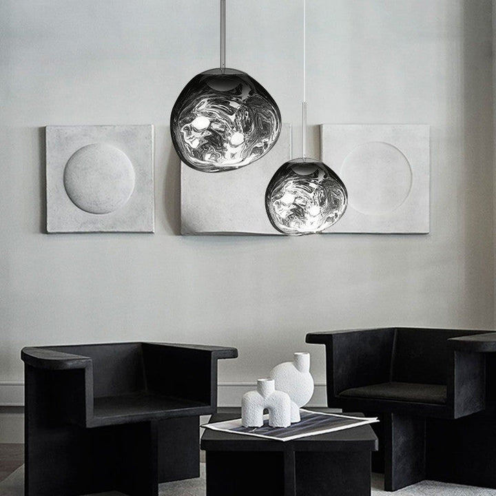 Sculptural Melt pendant light, artistic lighting for dining areas, unique metallic glow.