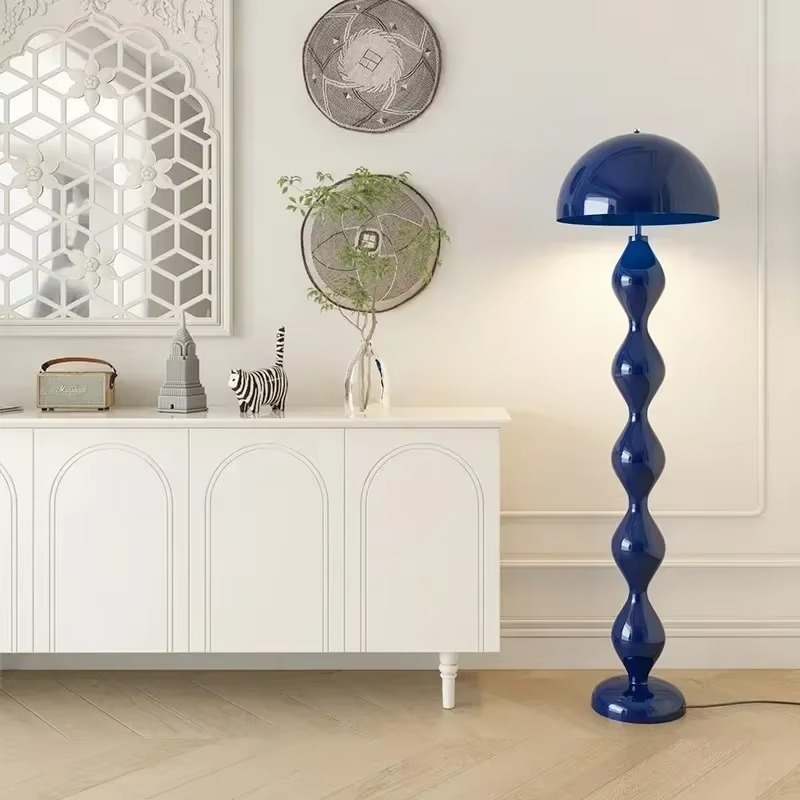"Modern Scandinavian floor lamp with sleek metal frame and glowing shade in minimalist design for contemporary home decor."