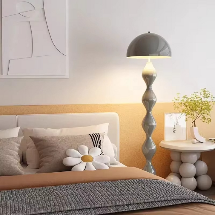 "Modern Scandinavian floor lamp with sleek metal frame and glowing shade in minimalist design for contemporary home decor."