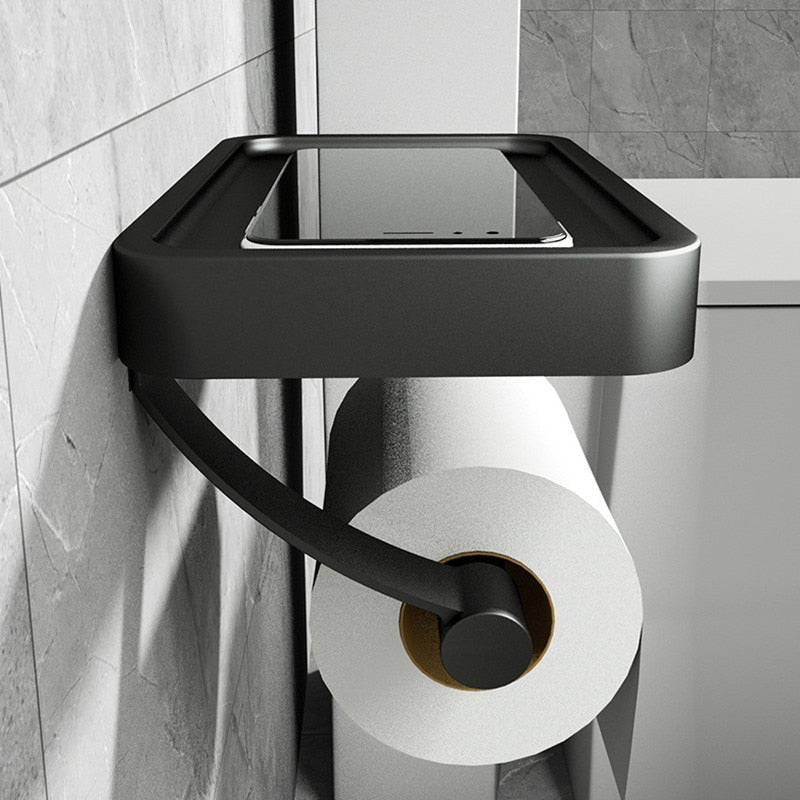 Sleek stainless steel toilet roll holder with a practical storage shelf for phone or small bathroom items.
