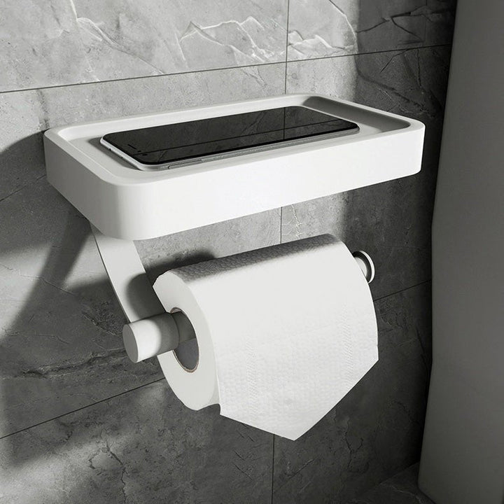 Space-saving stainless steel toilet roll holder with integrated storage shelf, perfect for modern bathroom decor.