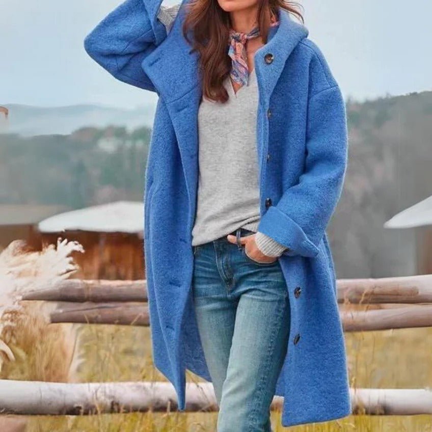 Woman wearing a stylish oversized outdoor jacket, perfect for cool weather adventures and fall fashion.