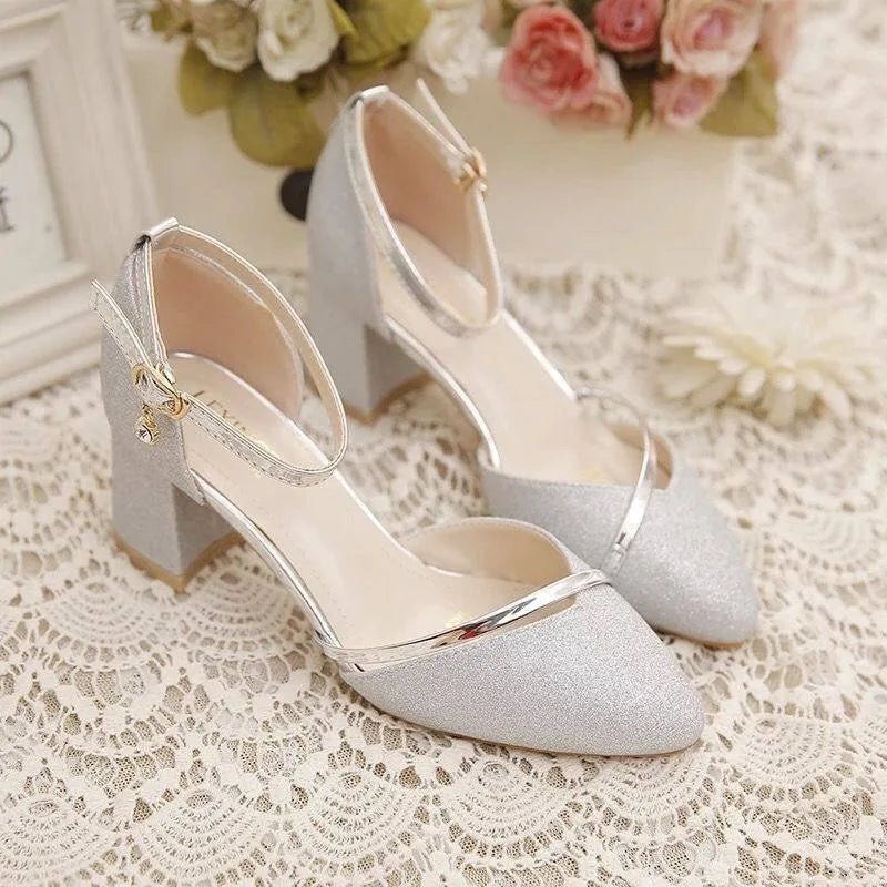 Comfortable silver block heel shoes for women, featuring an elegant ankle strap. Ideal for formal & party occasions.
