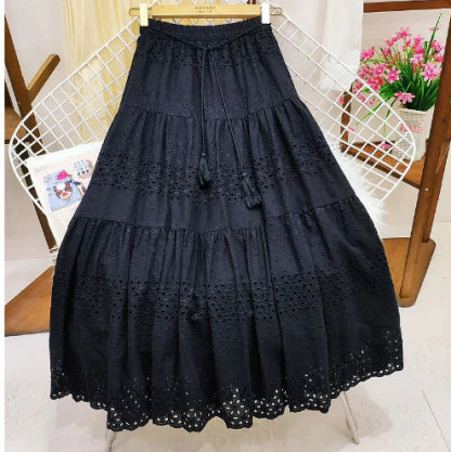 Boho style flowy tiered maxi skirt for women. Comfortable & versatile for summer, available in pink, white, black.