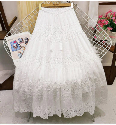 Comfortable women's tiered maxi skirt for summer fashion. Flowy design & elastic waist, great for vacation wear.