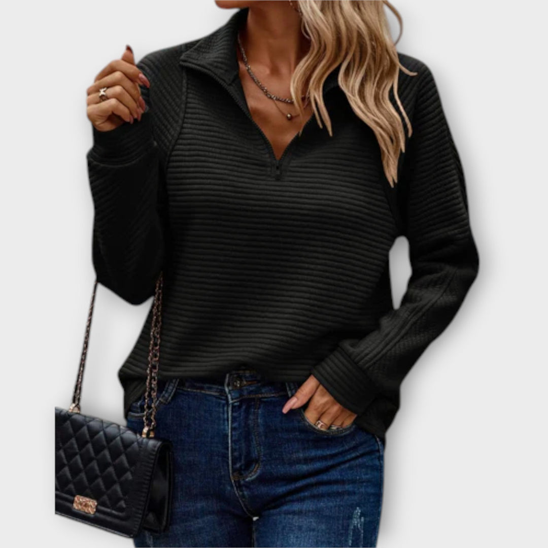 Comfortable women's V-neck jumper featuring a chic zipper. Long sleeve knitwear perfect for relaxation.