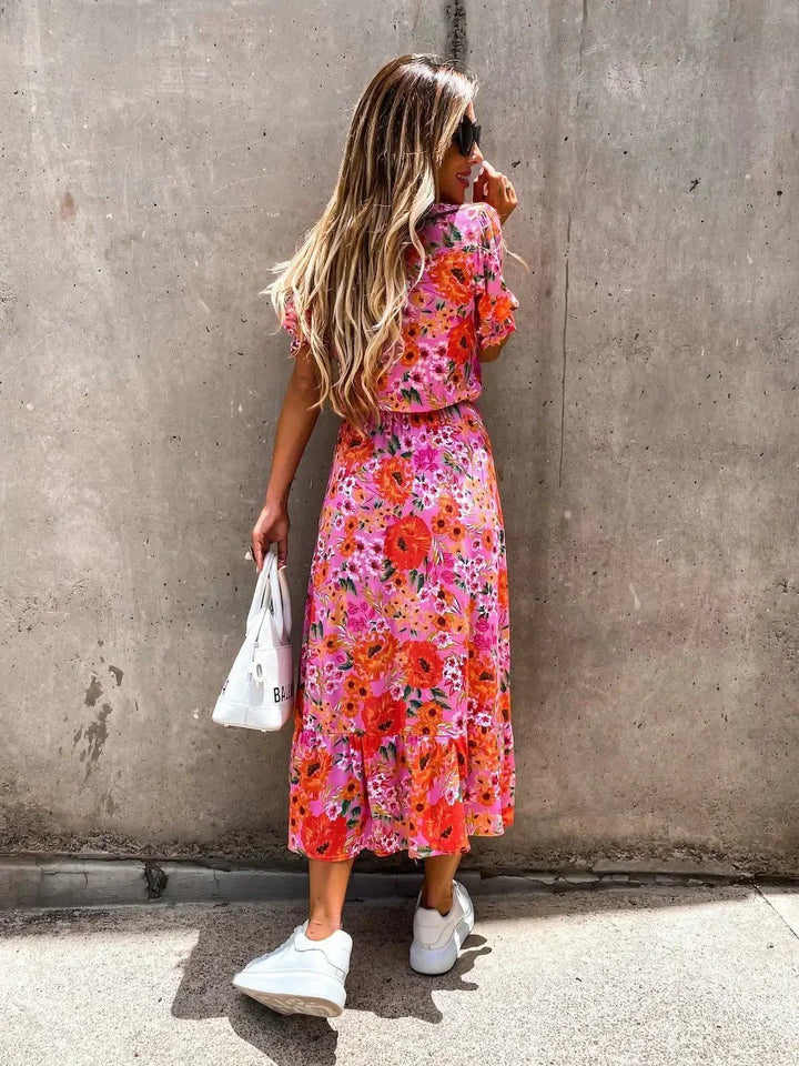 Women's elegant floral print summer midi dress, flowing gracefully, perfect vacation & resort wear.