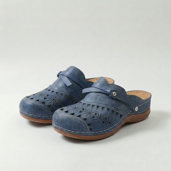 Women's orthopedic perforated mule clogs for all-day comfort & foot pain relief.
