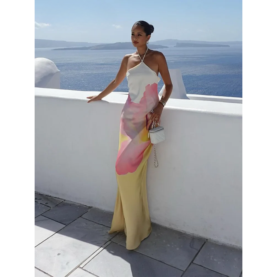 Chic white floral maxi dress, one-shoulder design for women. Elegant & flowy, ideal for summer parties & events.