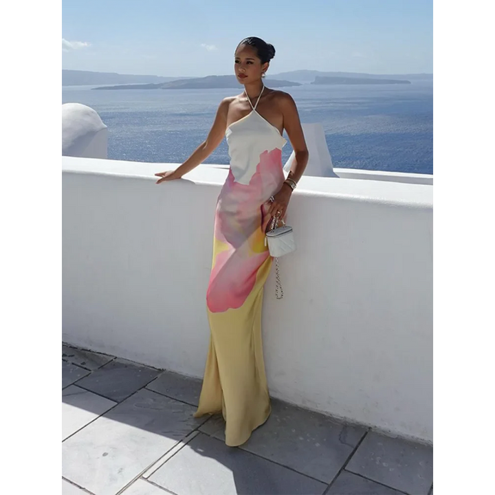Chic white floral maxi dress, one-shoulder design for women. Elegant & flowy, ideal for summer parties & events.