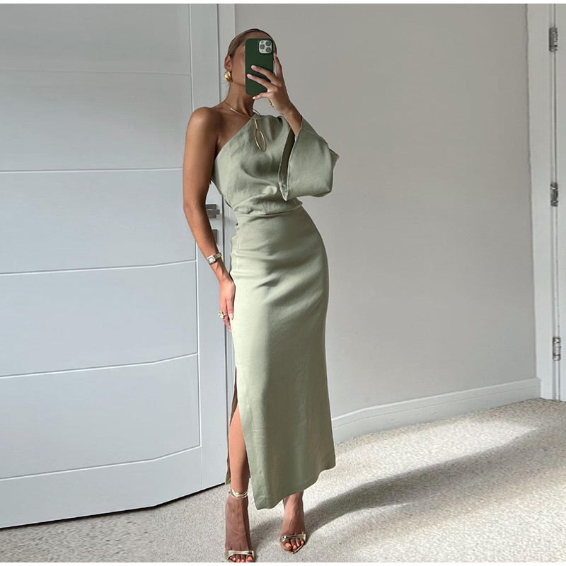Elegant women's asymmetrical one-shoulder maxi dress with a flowing design, perfect for summer occasions.