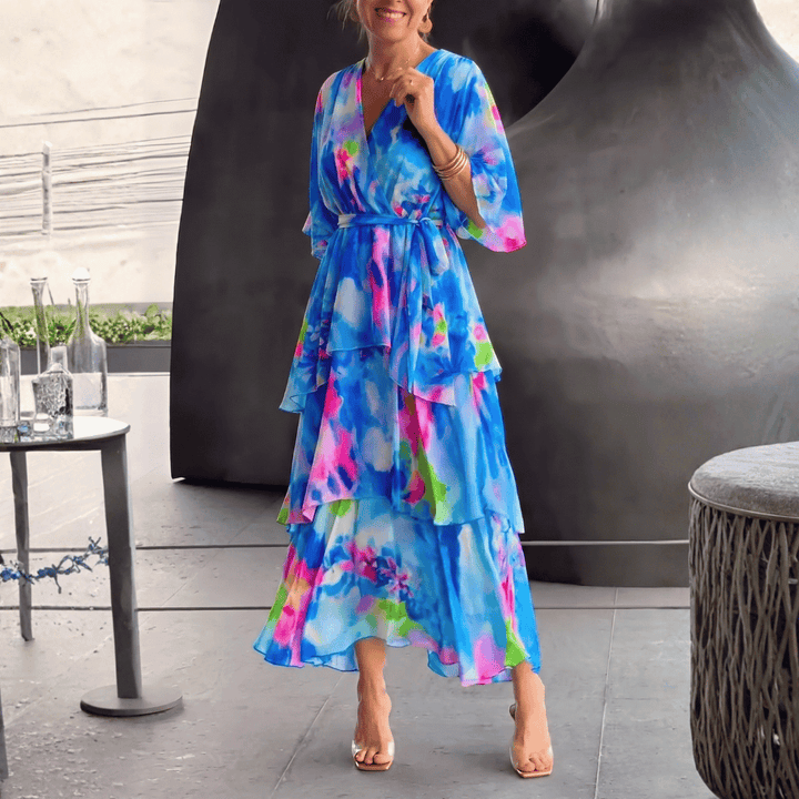 Elegant women's blue print V-neck midi dress, perfect for cocktail parties or formal occasions, flattering silhouette.