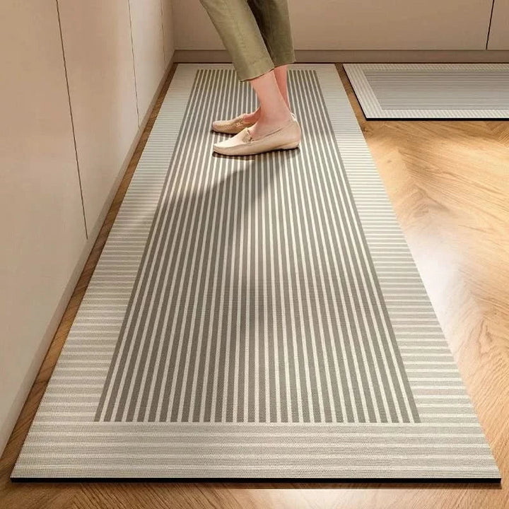 Durable anti-fatigue kitchen mat, featuring non-slip backing for safety & easy clean surface in stylish decor.
