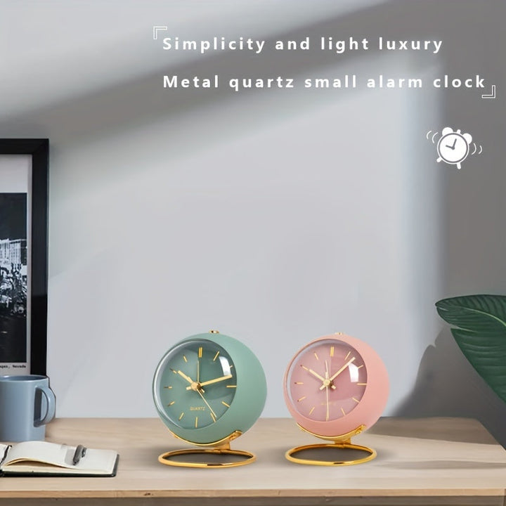 Battery-powered Nordic desk clock, silent movement, luminous hands & elegant metal frame.