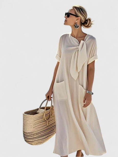 Versatile women's midi dress featuring a comfortable tie neck, convenient pockets, and an elegant summer style.