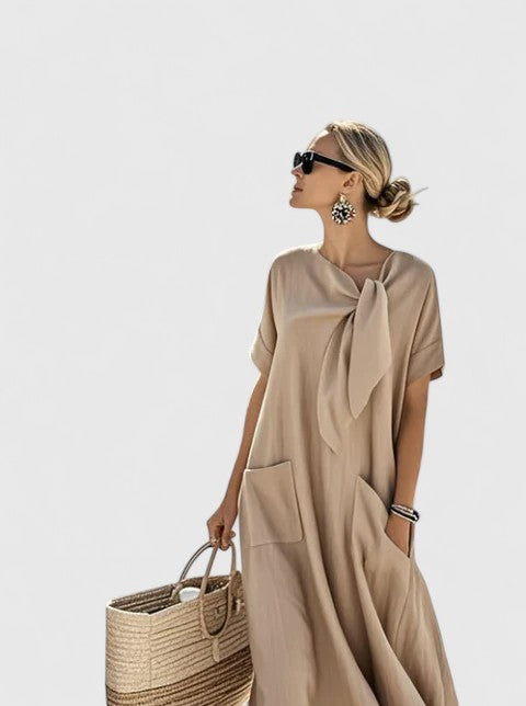 Stylish women's summer midi dress, elegant design, tie neck detail, practical pockets, versatile fashion.