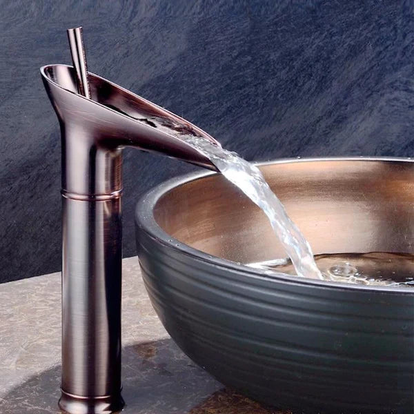 Architecturally inspired brass waterfall faucet, adding luxury to your bathroom.