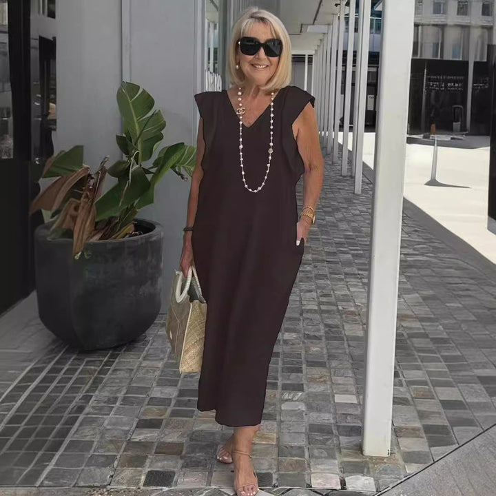 Women's versatile sleeveless summer dress, elegant flowy maxi style, V-neck, ideal for casual or vacation comfort.