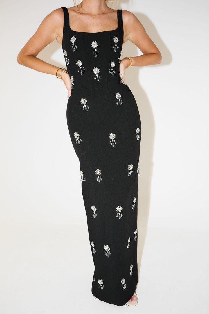 Glamorous two-piece women's maxi skirt set with sparkling crystal embellishments for dazzling party wear.