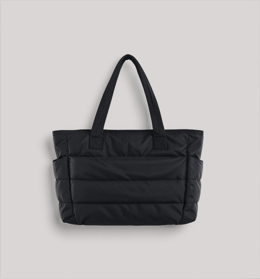 Elegant women's spacious puffer shoulder bag, a versatile fashion accessory. Stylish soft handbag for daily use.