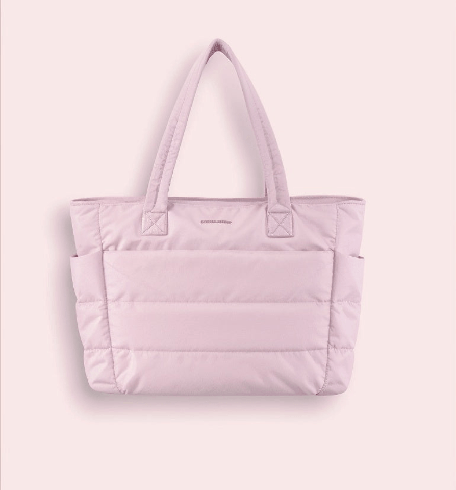 Versatile women's spacious puffer shoulder bag. An elegant, soft handbag, perfect as a stylish fashion accessory.