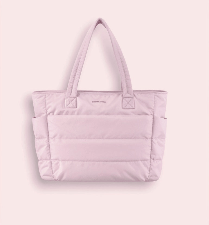 Versatile women's spacious puffer shoulder bag. An elegant, soft handbag, perfect as a stylish fashion accessory.