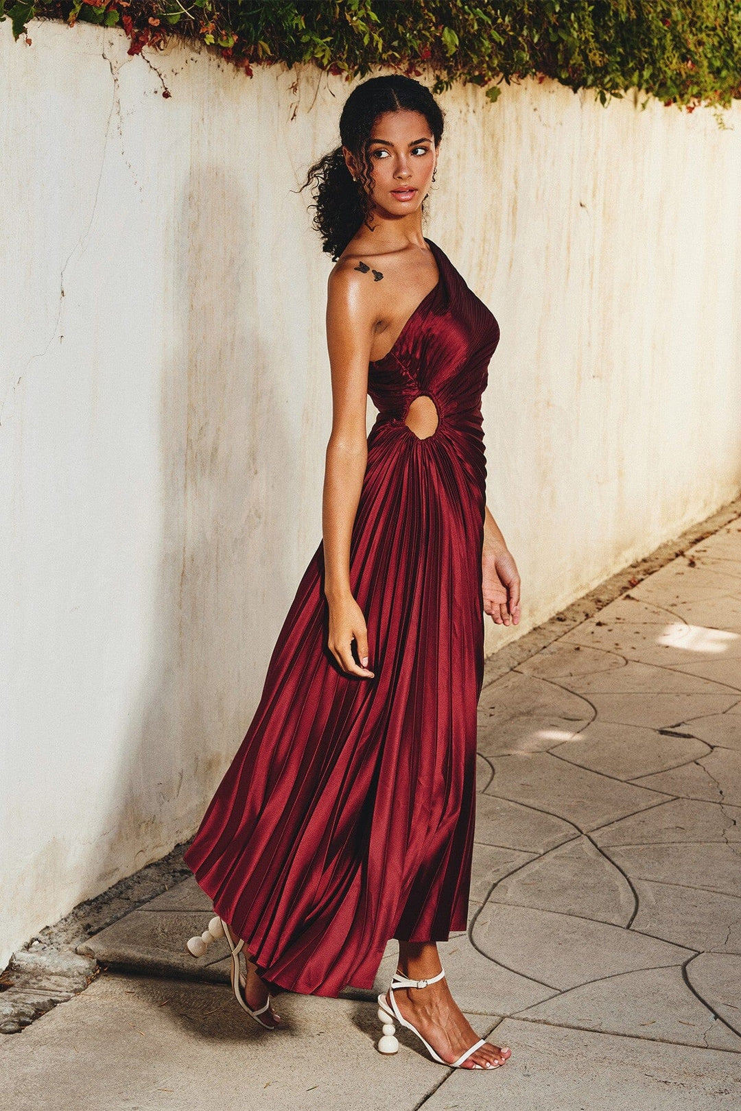 Formal women's midi dress, one-shoulder pleated design for elegant evening wear.