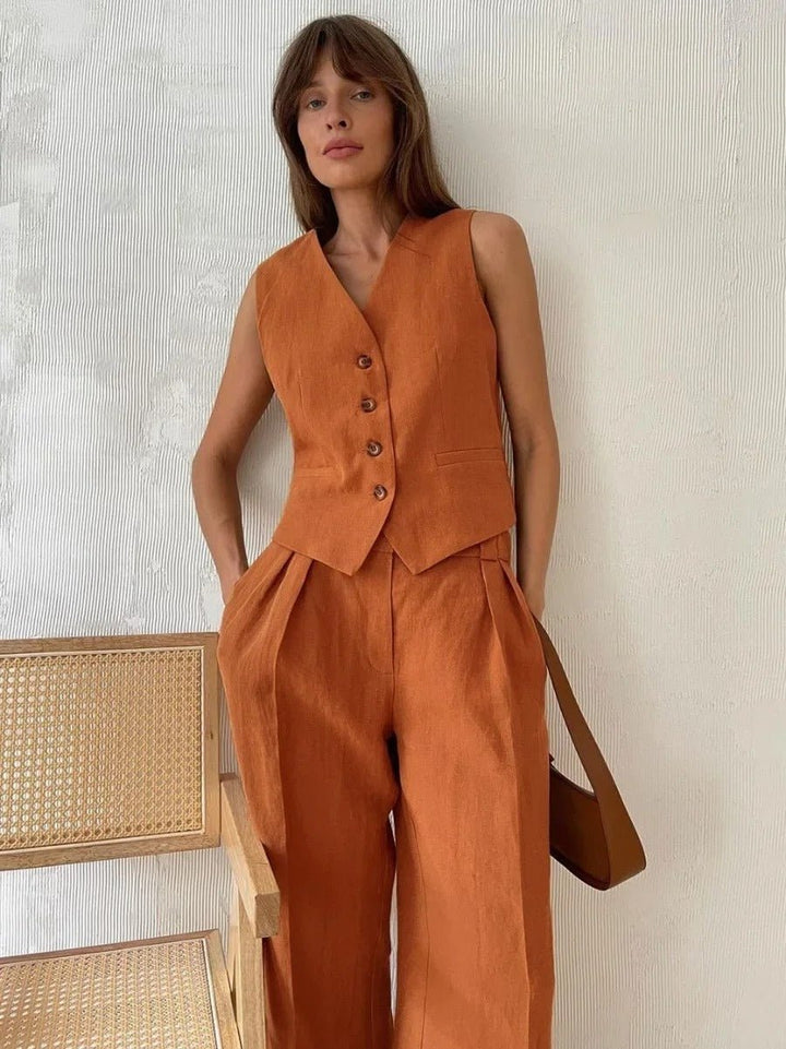 Elegant women's sleeveless vest and high-waisted wide-leg trousers two-piece set. A versatile, modern summer outfit.