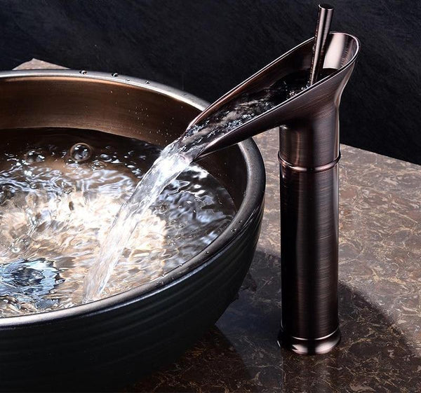 Solid brass waterfall basin tap, robust construction for daily bathroom use.