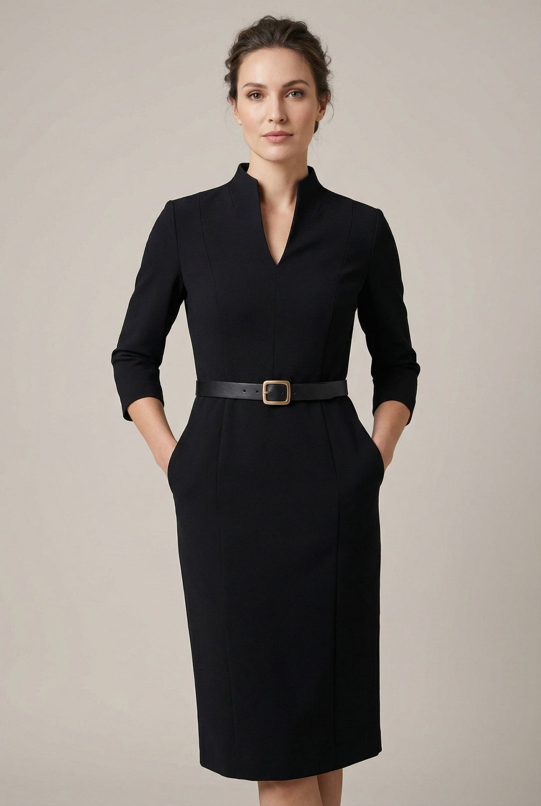 Elegant women's belted midi dress, perfect for professional wear or special occasions, in a timeless tailored style.