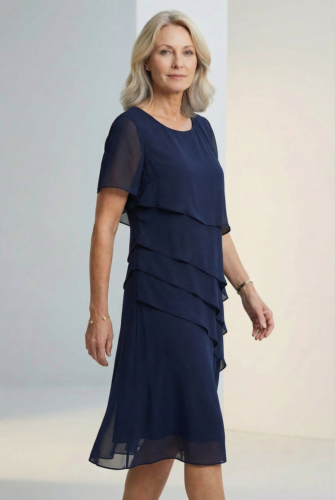 Flowing silhouette women's midi dress with elegant ruffles & sheer sleeves, ideal for chic spring/summer fashion.