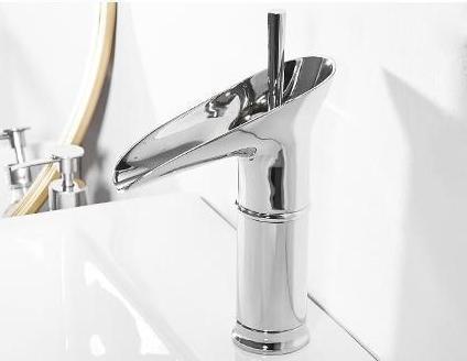 Golden brass waterfall mixer tap, elegant and timeless design for basins.