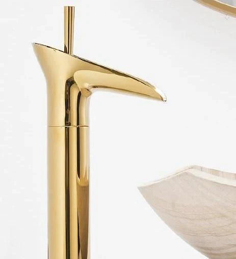 Elegant brass waterfall basin faucet, enhancing modern and traditional decors.