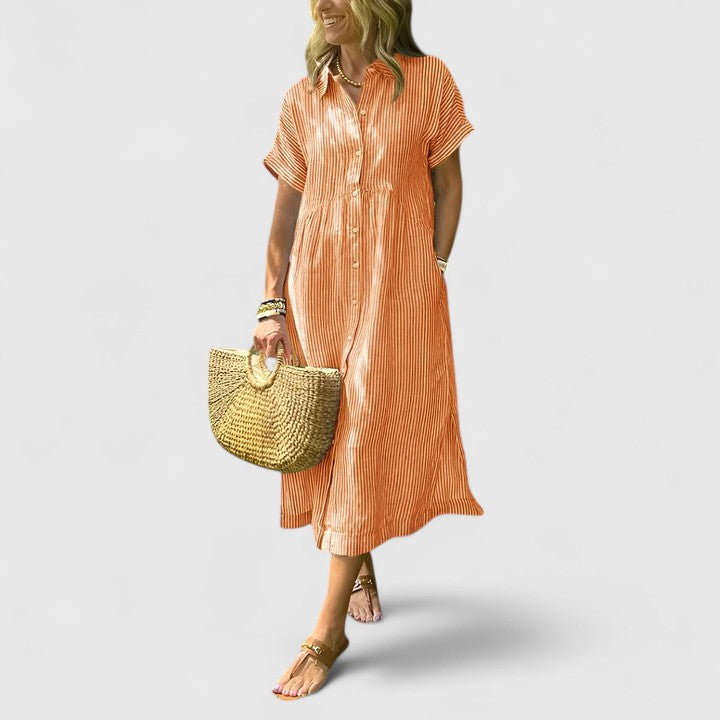 Model wearing comfortable women's vertical stripe midi dress, a flattering and versatile wardrobe staple.