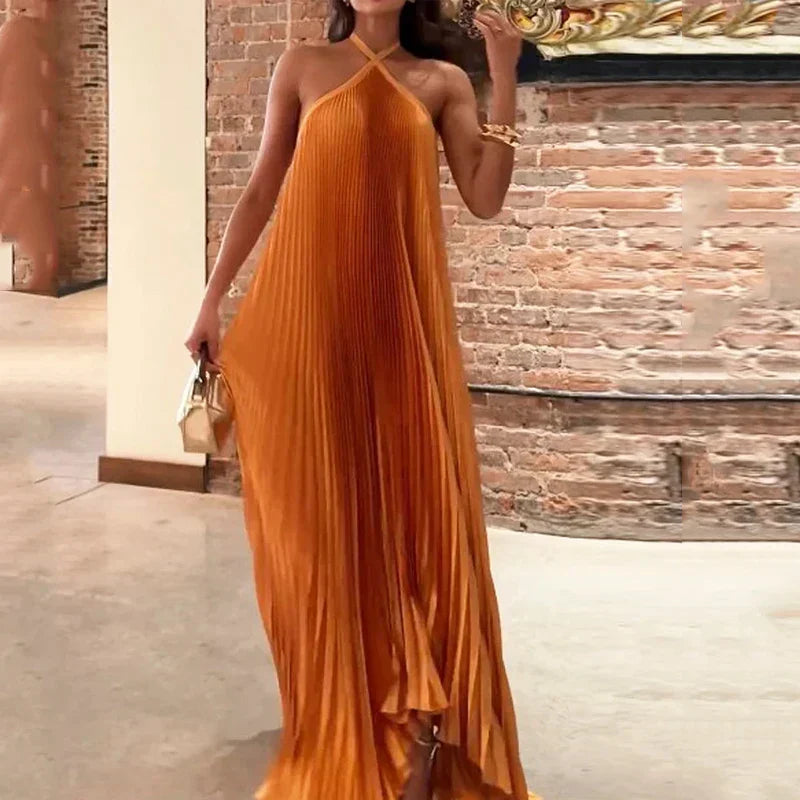 Stunning orange maxi neckholder dress for women, featuring elegant pleats, ideal for formal wear, parties & events.