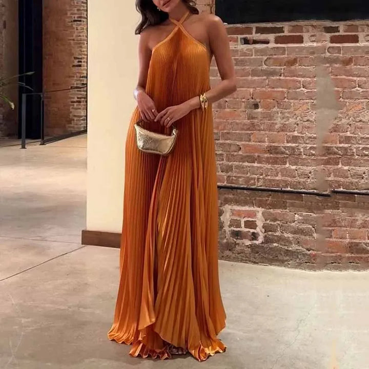 Elegant women's orange pleated maxi dress with a sophisticated neckholder design, perfect for evening parties & special occasions.