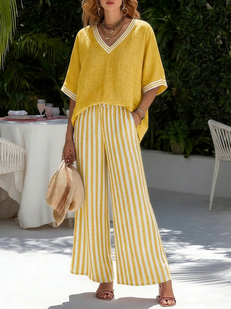 Woman wearing a comfortable V-neck top & striped wide-leg pant set, perfect casual fashion for everyday wear.