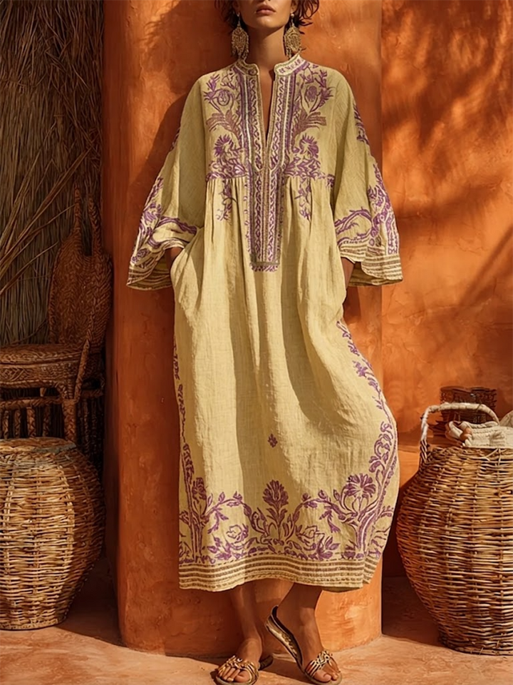 Elegant women's embroidered maxi dress with V-neck, bell sleeves, and relaxed fit, perfect for summer vacation.